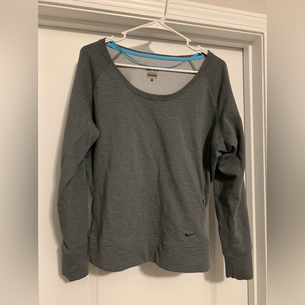 Women’s size Small Nike top with pocket. Looks brand new.  Worn a few times.
